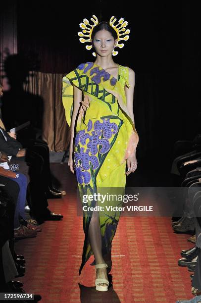 Model walks the runway during the Yoshiki Hishinuma Couture show as part of Paris Fashion Week Haute-Couture Fall/Winter 2013-2014 at the Hotel...