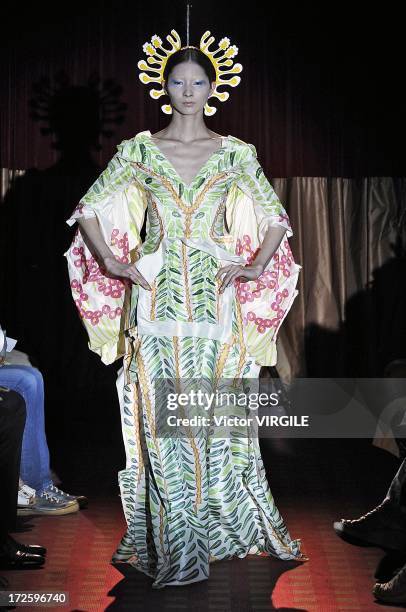 Model walks the runway during the Yoshiki Hishinuma Couture show as part of Paris Fashion Week Haute-Couture Fall/Winter 2013-2014 at the Hotel...