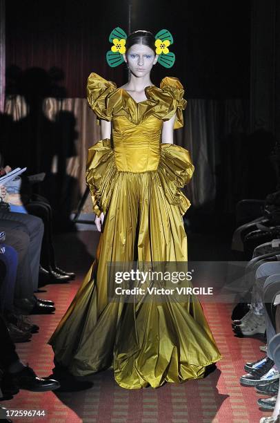 Model walks the runway during the Yoshiki Hishinuma Couture show as part of Paris Fashion Week Haute-Couture Fall/Winter 2013-2014 at the Hotel...