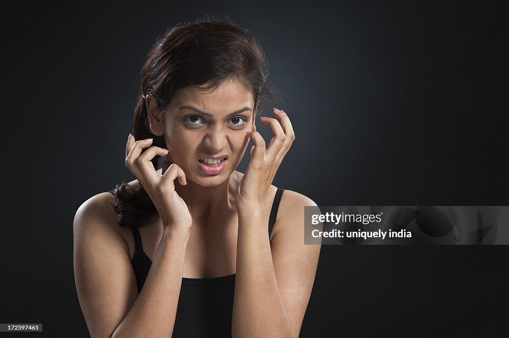 Portrait of a woman looking angry