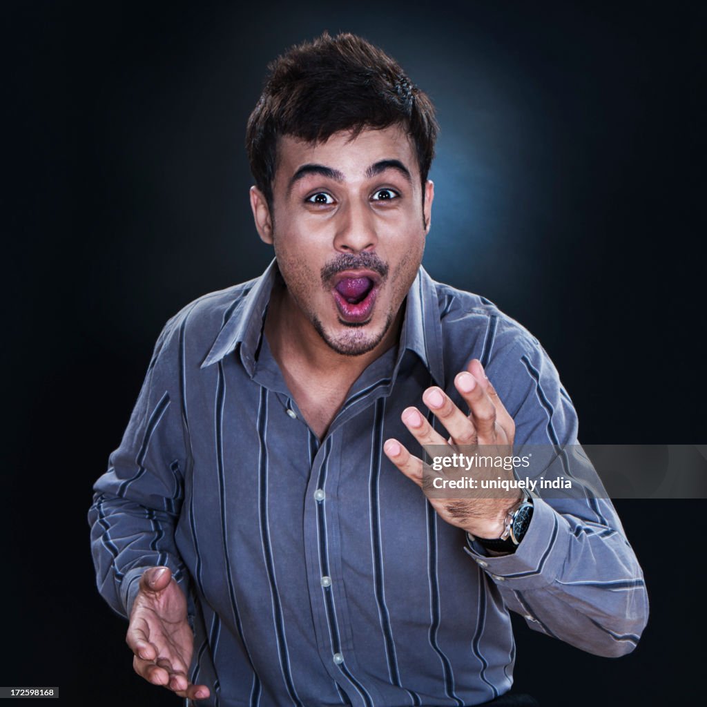 Close-up of a businessman looking surprised