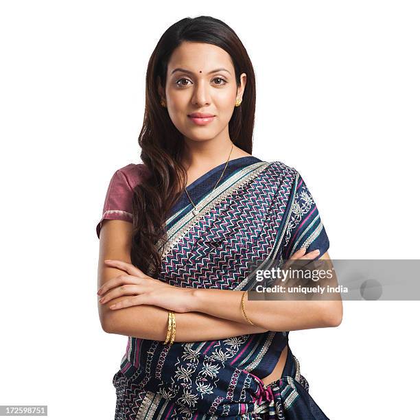 woman standing with her arms crossed and smiling - bindi fotografías e imágenes de stock