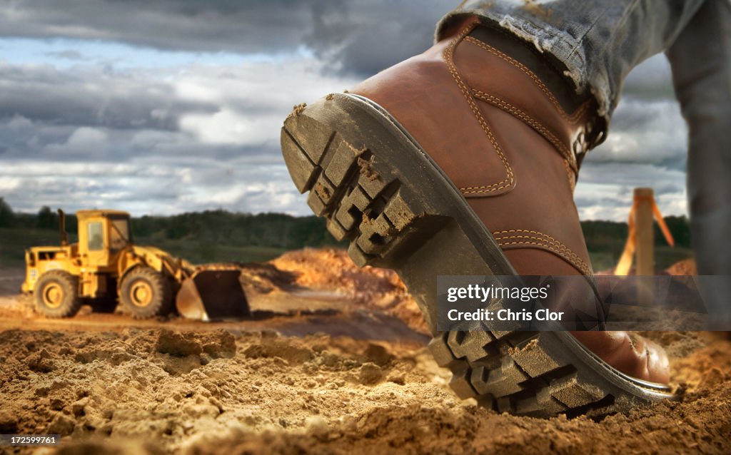 Close up of worker's boot on construction site
