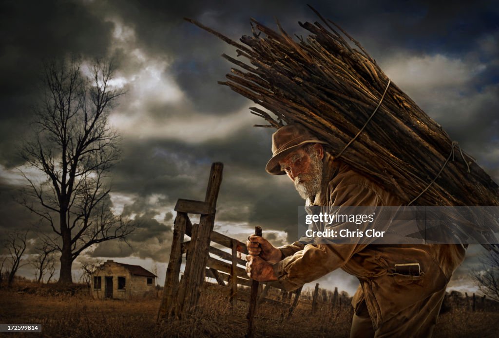 Illustration of Caucasian man carrying wood bundle on back