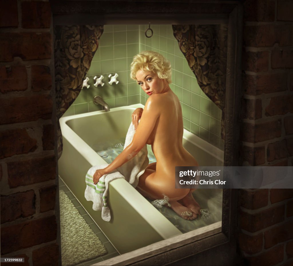 Illustration of Caucasian woman washing in bathtub