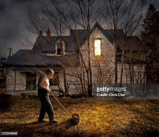caucasian man mowing lawn outside home - rundown stock illustrations