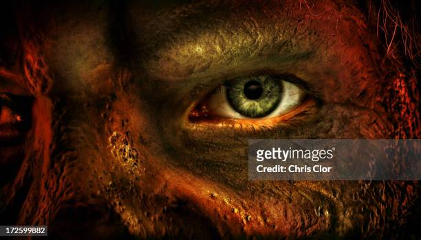 close up of man's eye and burned skin - scary monster fotografías e imágenes de stock