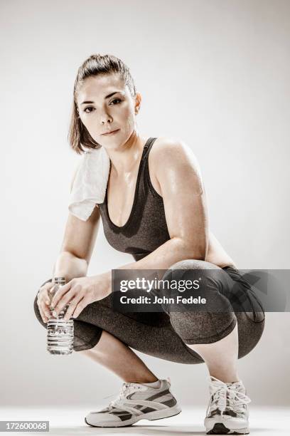 caucasian woman resting after workout - sport drinking bottle stock-fotos und bilder