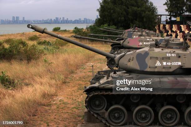 As the city of Xiamen, China, is seen in the background, retired M41 “Walker Bulldog” light tanks, which had served the Taiwanese Army for 63 years,...