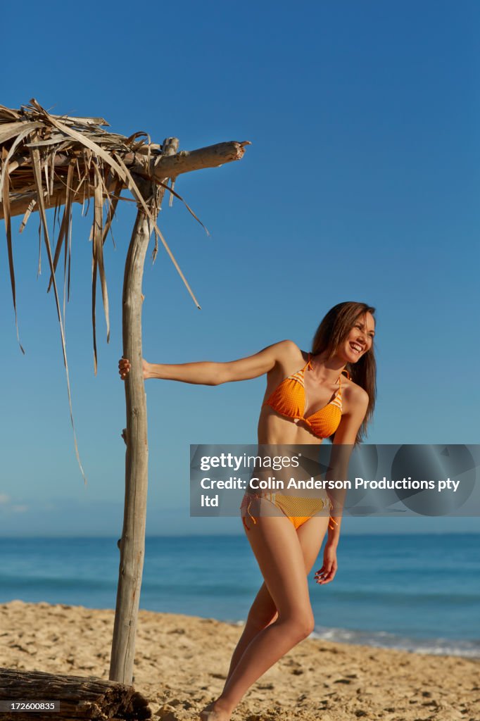 Pacific Islander woman relaxing on beach