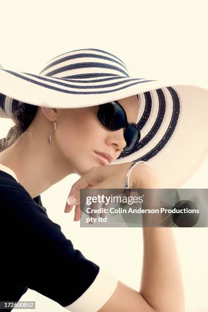 pacific islander woman wearing sunhat - glamour fashion stock pictures, royalty-free photos & images