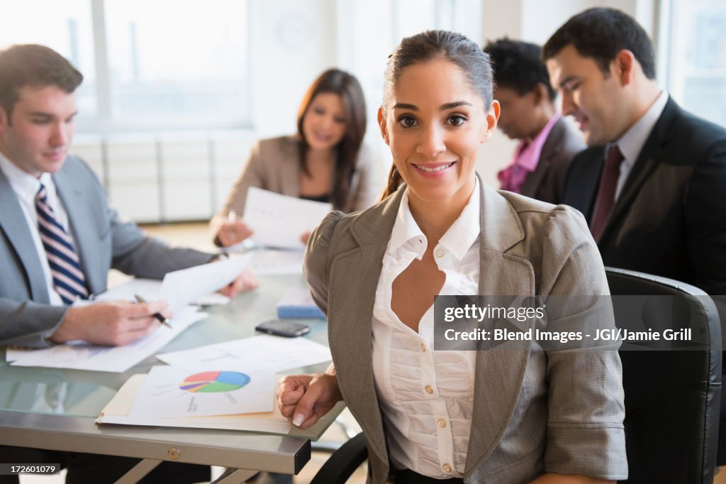 Businesswoman smiling in meeting