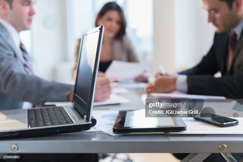 Close up of laptop, tablet computer and cell phone in office