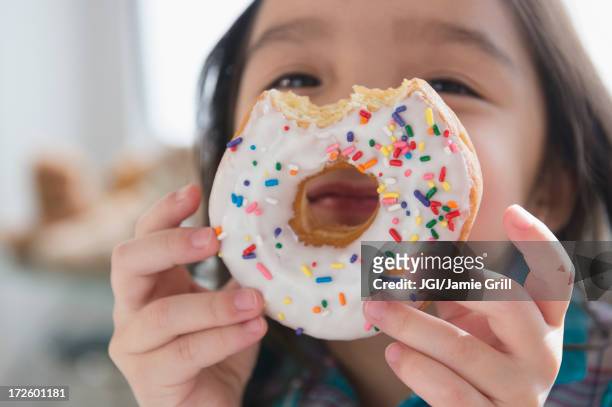 asian girl peeking through donut hole - donut stock pictures, royalty-free photos & images