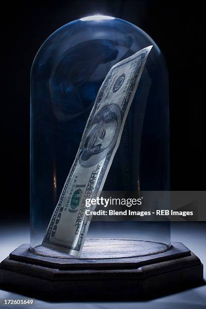 dollar bill in bell jar - bell jar ストックフォトと画像