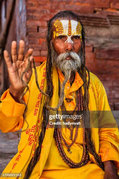 sadhu - indian holyman sitting in the temple - religious role stock pictures, royalty-free photos & images