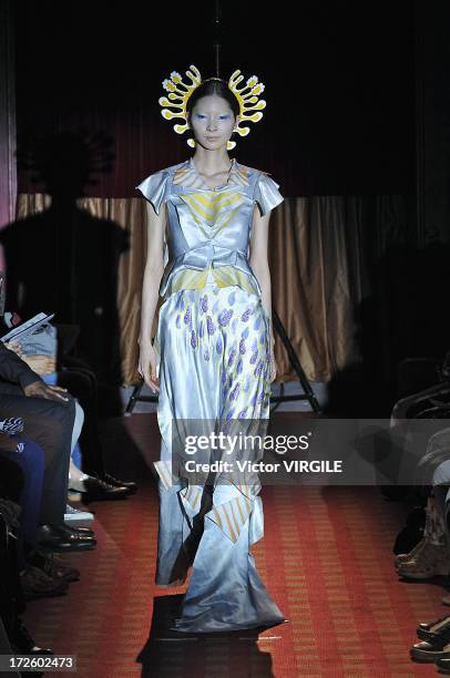 Model walks the runway during the Yoshiki Hishinuma Couture show as part of Paris Fashion Week Haute-Couture Fall/Winter 2013-2014 at the Hotel...