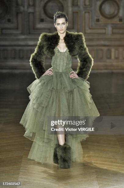 Model walks the runway during the Serkan Cura Couture show as part of Paris Fashion Week Haute-Couture Fall/Winter 2013-2014 at the Mairie du 4e on...