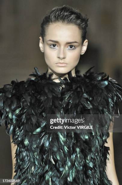 Model walks the runway during the Serkan Cura Couture show as part of Paris Fashion Week Haute-Couture Fall/Winter 2013-2014 at the Mairie du 4e on...