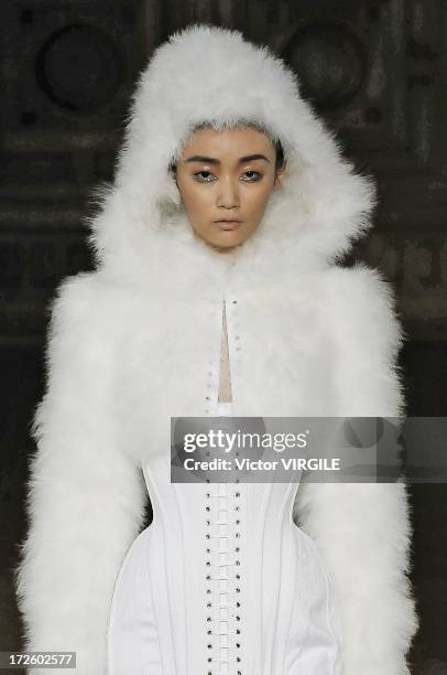 Model walks the runway during the Serkan Cura Couture show as part of Paris Fashion Week Haute-Couture Fall/Winter 2013-2014 at the Mairie du 4e on...