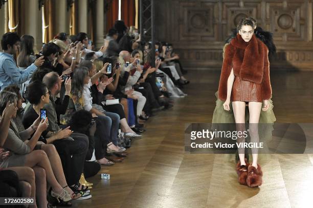 Model walks the runway during the Serkan Cura Couture show as part of Paris Fashion Week Haute-Couture Fall/Winter 2013-2014 at the Mairie du 4e on...