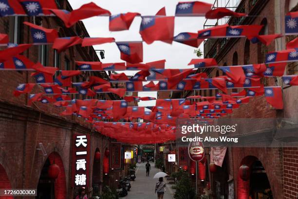 Taiwanese flags fly above Mofan Street on October 6, 2023 in Kinmen, Taiwan. Kinmen is a group of islands in the Taiwan Strait that is governed by...
