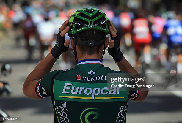 Thomas Voeckler of France riding for Team Europcar adjusts his helmet as he prepares for the start of stage five of the 2013 Tour de France, a...