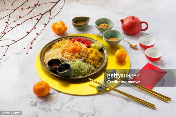 chinese new year food 'yu sheng' (prosperity raw fish salad). - prosperity toss stock pictures, royalty-free photos & images
