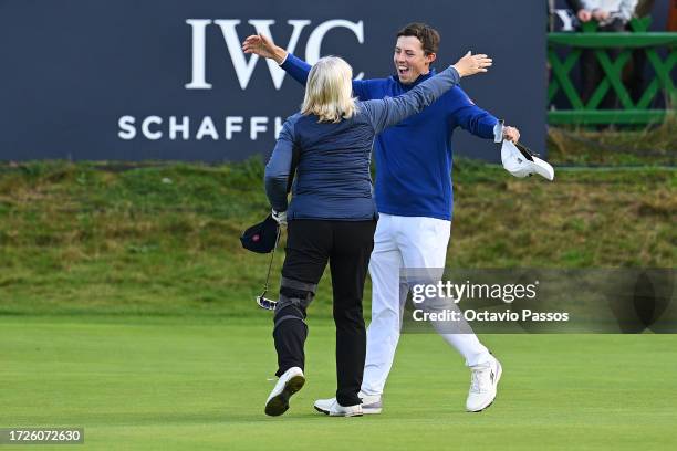 Matt Fitzpatrick of England embraces his Mother and playing partner, Susan Fitzpatrick on the 18th green during Round Three on Day Five of the Alfred...