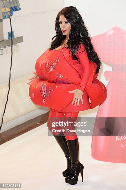 Katie Price poses as she launches her new fragrance 'Kissable' at The Work Studios on July 4, 2013 in London, England.