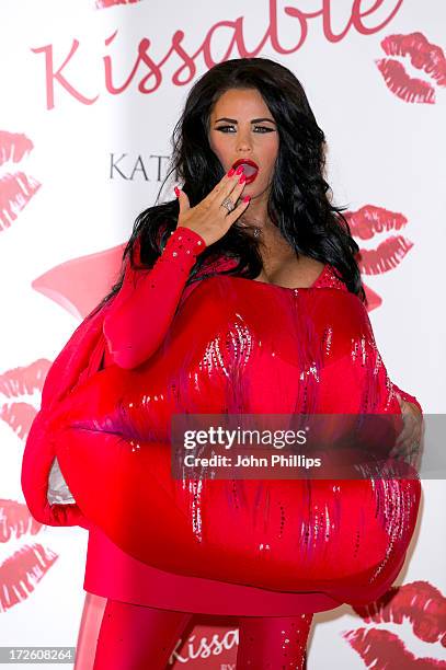 Katie Price attends a photocall to launch her new fragrance 'Kissable' at The Worx Studio's on July 4, 2013 in London, England.