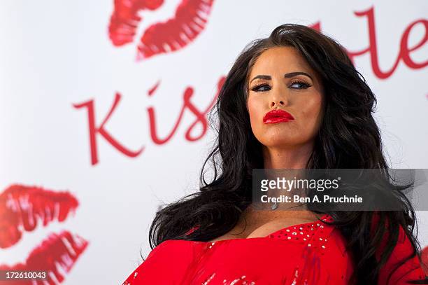 Katie Price attends a photocall to launch her new fragrance 'Kissable' at The Worx Studio's on July 4, 2013 in London, England.