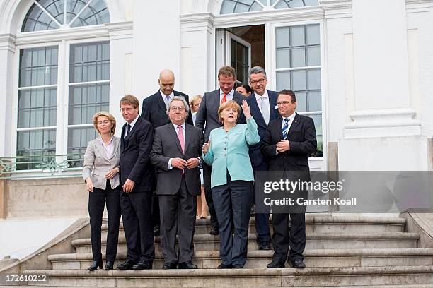 German Chancellor Angela Merkel poses for a group photo with German Minister of Work and Social Issues Ursula von der Leyen , Roland Pofalla ,...