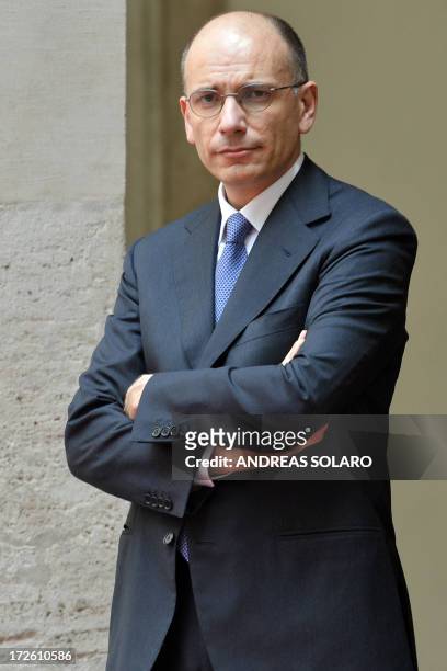 Italian Prime Minister Enrico Letta waits for the arrival of Libyan Prime Minister Ali Zeidan on July 4, 2013 at Palazzo Chigi in Rome. AFP PHOTO /...