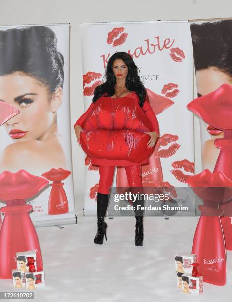 Katie Price attends a photocall to launch her new fragrance 'Kissable' at The Worx Studio's on July 4, 2013 in London, England.