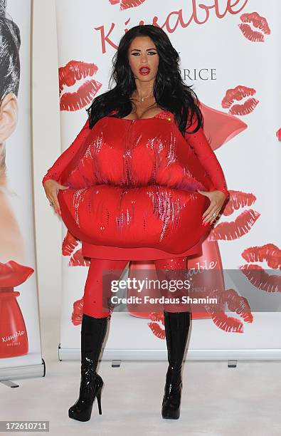 Katie Price attends a photocall to launch her new fragrance 'Kissable' at The Worx Studio's on July 4, 2013 in London, England.