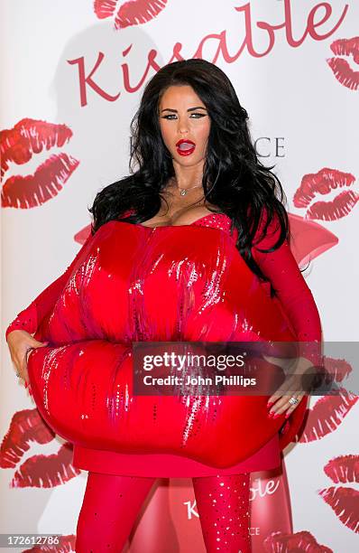 Katie Price attends a photocall to launch her new fragrance 'Kissable' at The Worx Studio's on July 4, 2013 in London, England.