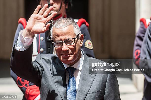 Libyan Prime Minister Ali Zeidan waves as he arrives for a meeting with Italian Prime Minister Enrico Letta at Palazzo Chigi on July 4, 2013 in Rome,...