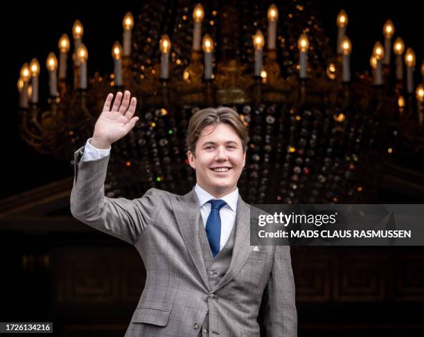 Denmark's Prince Christian waves to the crowds from the balcony of Frederik VIII at Amalienborg Castle in Copenhagen, during the celebration of his...