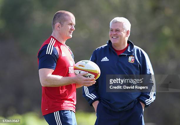 Graham Rowntree , the Lions forwards coach talks to head coach Warren Gatland during a British and Irish Lions training session at Noosa Dolphins RFA...