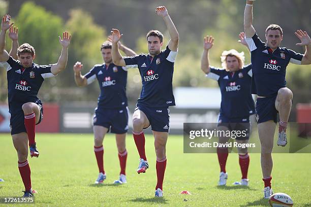 Leigh Halfpenny, Mike Phillips, Conor Murray, Richard Hibbard and Tommy Bowe warm up during a British and Irish Lions training session at Noosa...