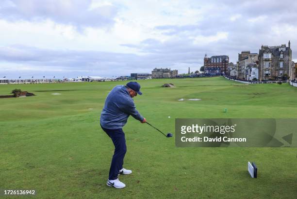 Sir Ian Botham of England the former cricketer plays his tee shot on the 18th hole during round three on Day Five of the Alfred Dunhill Links...