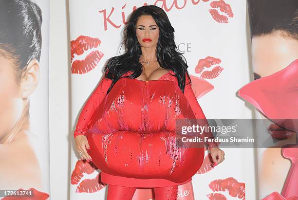 Katie Price attends a photocall to launch her new fragrance 'Kissable' at The Worx Studio's on July 4, 2013 in London, England.