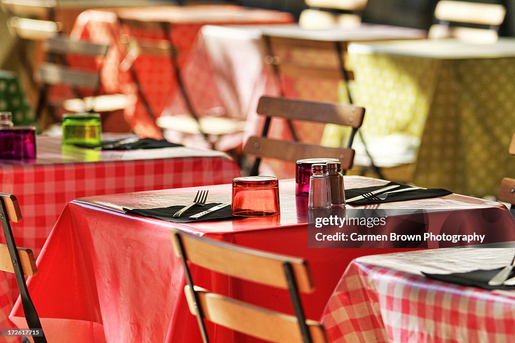 Bistro tables set for lunch in a provencal town