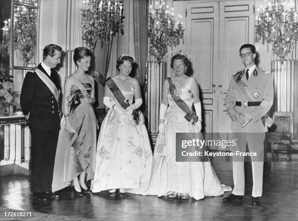 During an official visit, Queen Juliana and her daughter Princess Beatrix with King Baudoin, Prince Albert and Princess Paola during the reception at...