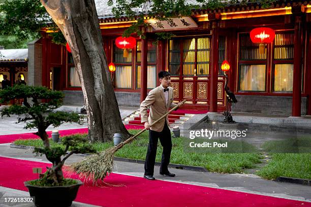 Chinese attendant prepares for the arrival of Pakistan Prime Minister Nawaz Sharif for a meeting with Chinese President Xi Jinping, at the Diaoyutai...