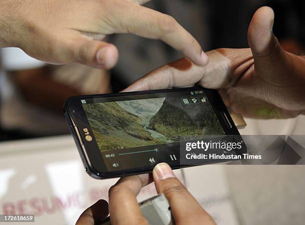 Peoples using just launched LG Optimus G Pro on July 4, 2013 in New Delhi, India. With 5.5 inch full HD display Optimus G Pro runs on Android...