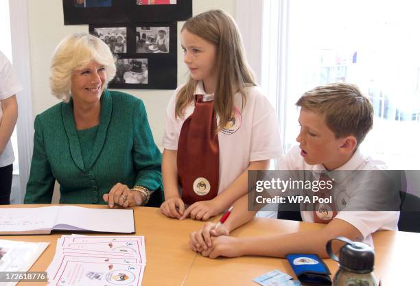 Camilla, Duchess of Cornwall visits LASA Credit Union on July 4, 2013 in Swansea, Wales. LASA Credit Union is working with Her Majesty's Prison...