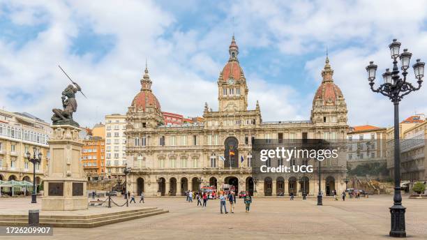 City hall in Praza de Maria Pita. La Coruna, La Coruna Province, Galicia, Spain. The statue on the left is of Maria Pita - whom the square is named...