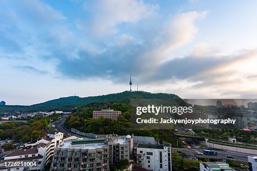 Seoul's central city skyline at sunrise N Seoul Tower seen from above in Namsan Park during the morning's twilight hours. The best vantage point and hiking in Seoul, South Korea